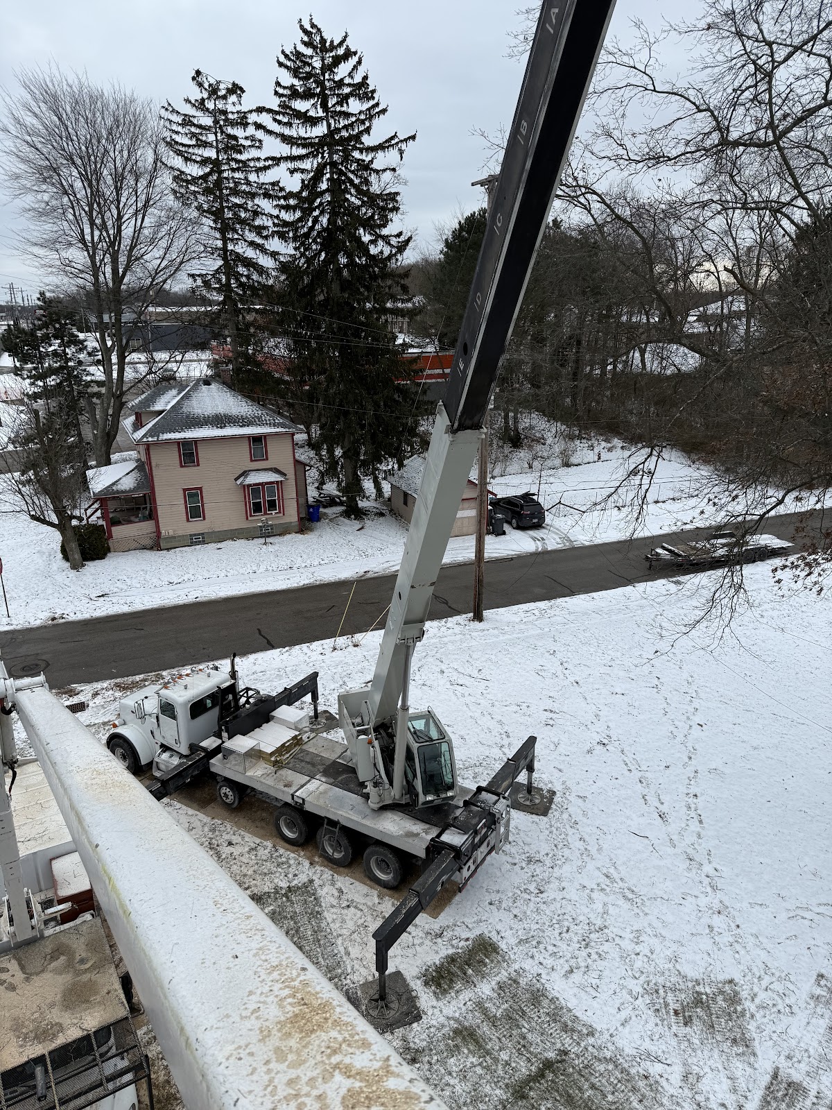 Aerial view of a deployed crane rig in snow