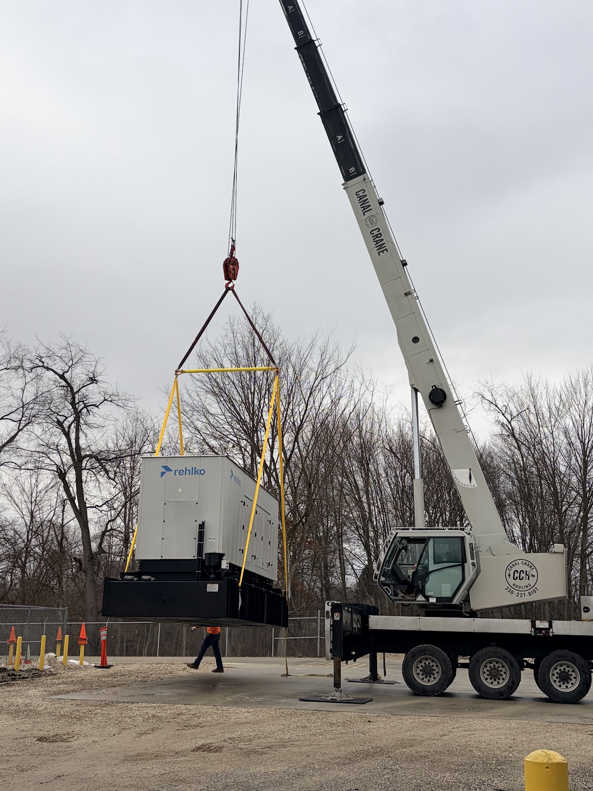 Crane lifting a generator